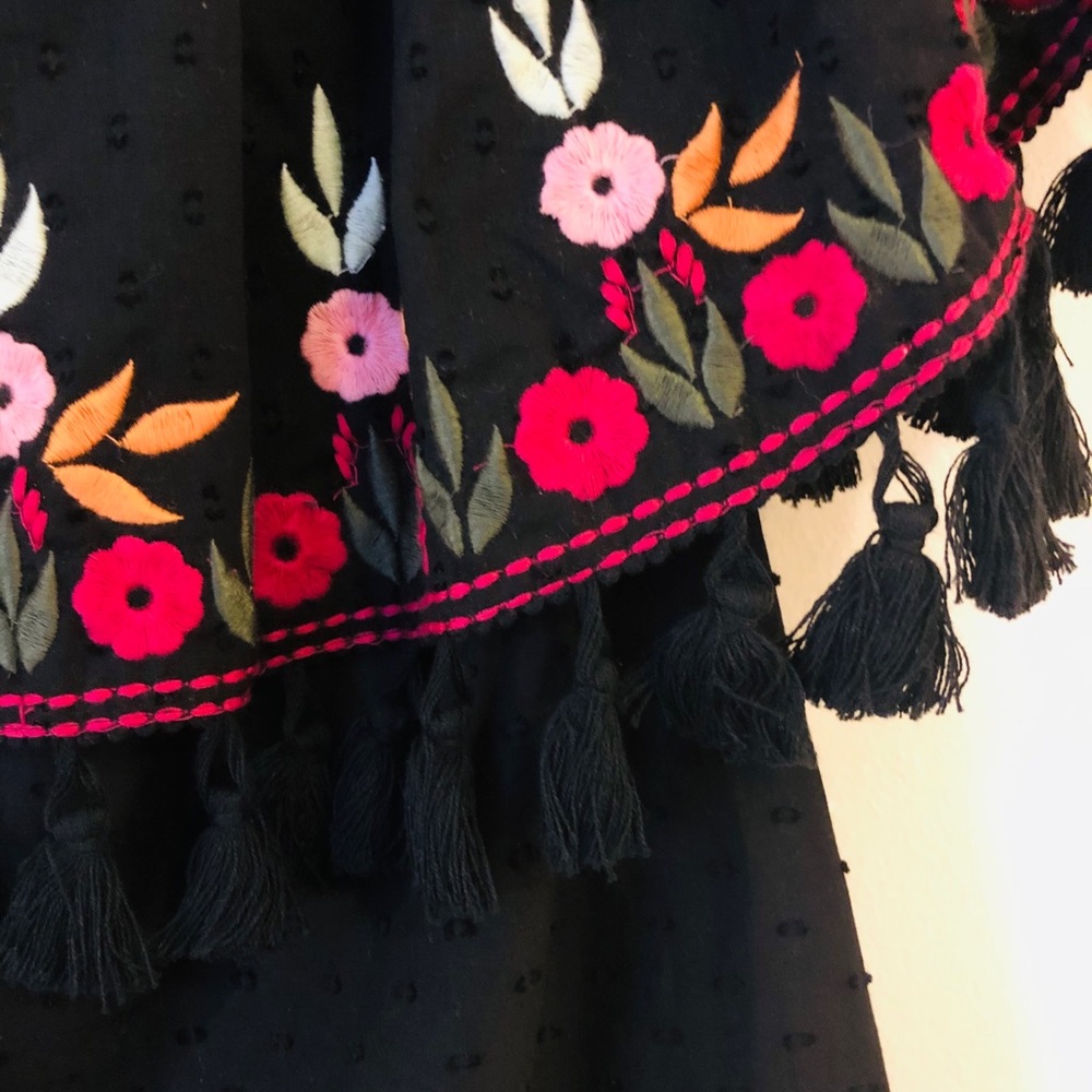 Black Spanish-style embroidered dress with fringe